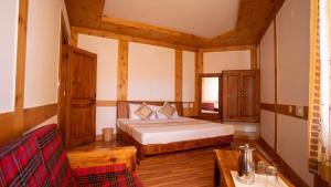A bed or beds in a room at THE CONIFER