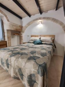a bedroom with a large bed in a room at Archi Antichi in Putignano