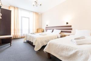 Una cama o camas en una habitación de Hotel Old Seti