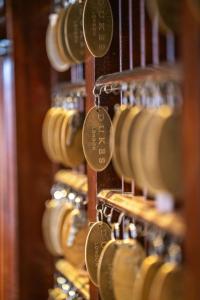 a bunch of wine barrels in a wine cellar at Dukes London in London