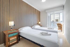 Łóżko lub łóżka w pokoju w obiekcie Alteanos 16-2 Apartment Levante Beach