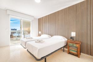 A bed or beds in a room at Alteanos 16-2 Apartment Levante Beach Még 29 kép