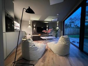 a living room with two white pillows on the floor at Contemporary Annex in Woodstock