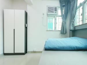 Tempat tidur dalam kamar di Student Accommodation - 26 Man Yuen Street