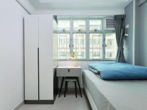 Llit o llits en una habitació de Student Accommodation - 26 Man Yuen Street