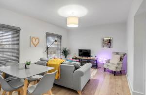 a living room with a couch and a table at *NEW* 2 bed apartment on Ber St Norwich in Norwich