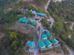 an aerial view of a parking lot with tents at Mountain Whisper, Most Unique Location in Rishikesh in Rishīkesh