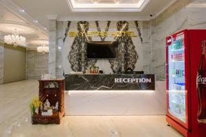 a room with a television and a counter in a store at Sky Star Hotel in Can Tho