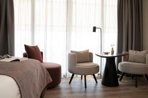 Łóżko lub łóżka w pokoju w obiekcie Bilderberg Europa Hotel Scheveningen