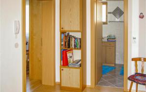 a room with a book shelf with books at Nice Apartment In Trins With 2 Bedrooms And Wifi in Trins