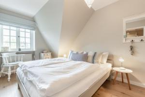 Ein Bett oder Betten in einem Zimmer der Unterkunft Ahoi