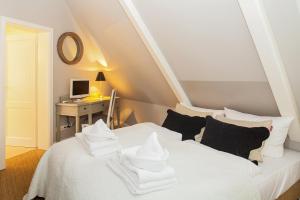 Ένα ή περισσότερα κρεβάτια σε δωμάτιο στο Kaeptn s Hues