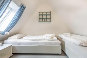 Postel nebo postele na pokoji v ubytování Westerhoern 46 Haus 2 App 24