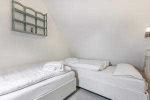 Postel nebo postele na pokoji v ubytování Westerhoern 46 Haus 2 App 24