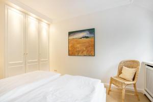 Ein Bett oder Betten in einem Zimmer der Unterkunft Tüchter