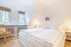Ein Bett oder Betten in einem Zimmer der Unterkunft Tüchter
