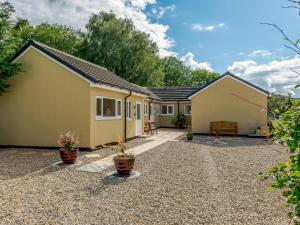 a house with a gravel yard in front of it at 1 Bed in 78725 in Tanfield