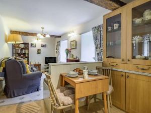 a kitchen with a table and a dining room at 1 bed in Llanwrtyd Wells BN254 in Beulah