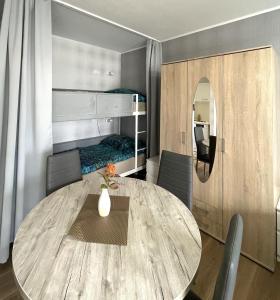 a dining room with a table and a bunk bed at Apartment in Neuss. 4 Personen in Neuss