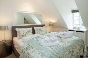 Ένα ή περισσότερα κρεβάτια σε δωμάτιο στο Seestern Keitum