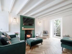 a living room with a couch and a fireplace at 3 Bed in Thornton-Le-Dale 82856 in Thornton Dale