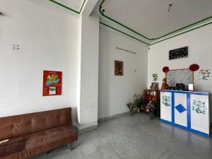 a living room with a couch and a table at SPOT ON 1222 Song Han Motel in Da Nang