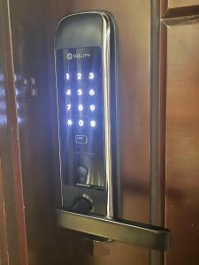 a close up of a refrigerator with a remote control at Student Accommodation - 5 Man Cheong Street in Hong Kong