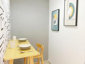 a dining room table with two bowls on it at Student Accommodation - 5 Man Cheong Street in Hong Kong