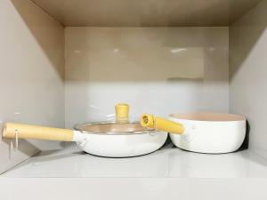 a mortar and pestle next to a bowl in a kitchen at Student Accommodation - 5 Man Cheong Street in Hong Kong