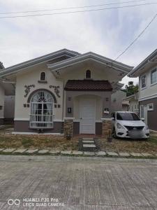 a car parked in front of a house at Japandi-Filipino Home 2-Bedrooms with Parking in Dauis