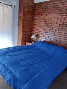 Ένα ή περισσότερα κρεβάτια σε δωμάτιο στο Muy cerca de la playa en San Bernardo