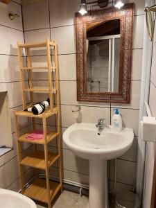 a bathroom with a sink and a mirror at Alloggio La Torre Fossanova in Priverno +17 photos