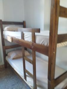a couple of bunk beds in a room at BIMBA HOSTEL - UNIDADE 03 - GOIÂNIA - GO in Goiânia