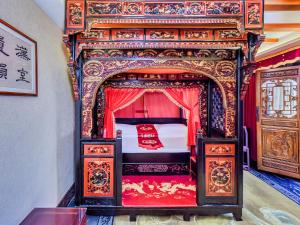 Un ou plusieurs lits dans un hébergement de l'établissement ChengDu Wuhou Temple Han Dynasty Hotel