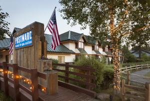 a building with a fence and an american flag at Postmarc Hotel and Spa Suites in South Lake Tahoe