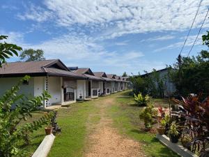 a row of houses with a dirt road at Bali Villa Mirissa in Mirissa