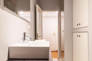 Postel nebo postele na pokoji v ubytování easyhomes - Spiga Suite