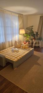 a bed in a living room with at Apartment Waltendorf in Graz