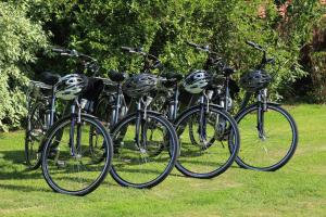 a group of bikes parked in the grass at Au Coeur Des Hôtes in Steenvoorde