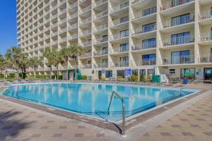 a large swimming pool in front of a hotel at The Summit 1426 in Panama City Beach