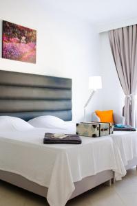Postel nebo postele na pokoji v ubytování Art Villa Dominicana + 37 fotografií