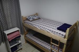 Lova arba lovos apgyvendinimo įstaigoje Casa de Temporada em Gramado