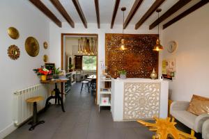 a living room with a couch and a table at Casa Caimari Guest House, for mountain lovers! in Caimari