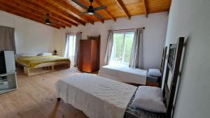 Una cama o camas en una habitación de Nuestro Faro en el Sur - Claromeco