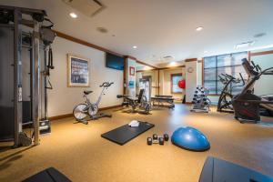 a gym with several exercise bikes and exercise equipment at First Tracks Lodge in Whistler
