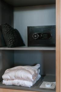 a shelf with a clock and a pillow on it at Andeluna Winery Lodge in Tupungato