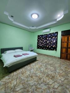 Postel nebo postele na pokoji v ubytování Jaaoo Homestay Betong - จ๊ะโอ๋โฮมสเตย์
