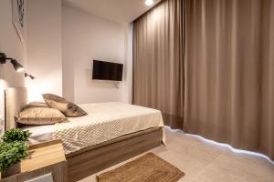 Ένα ή περισσότερα κρεβάτια σε δωμάτιο στο Increíble Loft junto a la ciudad de las ciencias