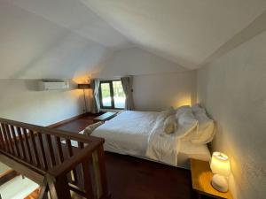 Кровать или кровати в номере Punpawn Farm-stay Villa B