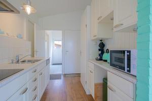 Η κουζίνα ή μικρή κουζίνα στο Vakantiehuis Zilt - Julianadorp aan Zee